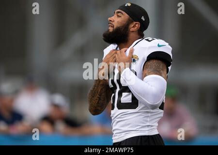 Jacksonville Jaguars wide receiver Jeff Cotton Jr. (88) is tackled by  Pittsburgh Steelers cornerback Linden Stephens (40) and cornerback Carlins  Platel (30) after catching a pass during the second half of a