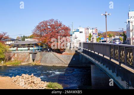 Mount Iwate scene with buildings and promenade at Katakami river in  Morioka city, Iwate prefecture, Tohoku, Japan. Stock Photo