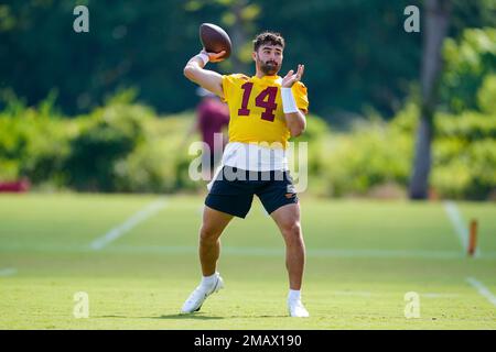 Washington Commanders quarterback Sam Howell (14) throws the ball during  the second half of a NFL preseason football game against the Baltimore  Ravens, Saturday, Aug 27, 2022, in Baltimore. (AP Photo/Terrance Williams