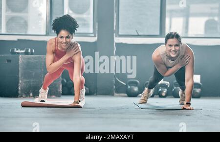 Woman, fitness and friends in class on mat for workout, exercise or training at the gym. Portrait of happy women with smile for healthy exercising Stock Photo