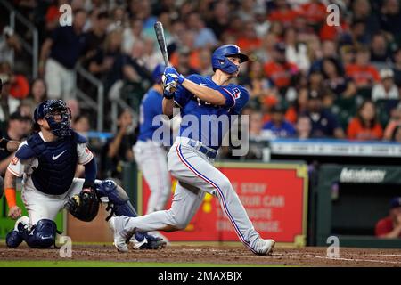 Texas Rangers' Corey Seager, right, hits a home run during the fifth ...