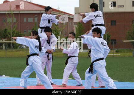 A Korean Taekwondo demonstration team begin the KATUSA Friendship Week ceremony with a martial arts performance on Camp Humphreys, Republic of Korea, 7 June, 2022. KATUSA Friendship Week is hosted annually to facilitate unit cohesion, solidify friendship and foster a cultural understanding between both countries. Stock Photo