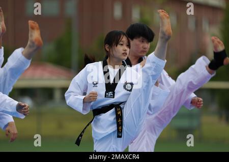 A Korean Taekwondo demonstration team begin the KATUSA Friendship Week ceremony with a martial arts performance on Camp Humphreys, Republic of Korea, 7 June, 2022. KATUSA Friendship Week is hosted annually to facilitate unit cohesion, solidify friendship and foster a cultural understanding between both countries. Stock Photo