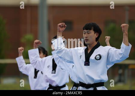 A Korean Taekwondo demonstration team begin the KATUSA Friendship Week ceremony with a martial arts performance on Camp Humphreys, Republic of Korea, 7 June, 2022. KATUSA Friendship Week is hosted annually to facilitate unit cohesion, solidify friendship and foster a cultural understanding between both countries. Stock Photo