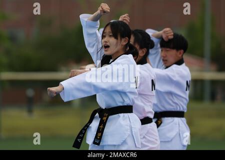 A Korean Taekwondo demonstration team begin the KATUSA Friendship Week ceremony with a martial arts performance on Camp Humphreys, Republic of Korea, 7 June, 2022. KATUSA Friendship Week is hosted annually to facilitate unit cohesion, solidify friendship and foster a cultural understanding between both countries. Stock Photo