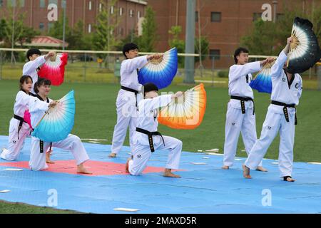 A Korean Taekwondo demonstration team begin the KATUSA Friendship Week ceremony with a martial arts performance on Camp Humphreys, Republic of Korea, 7 June, 2022. KATUSA Friendship Week is hosted annually to facilitate unit cohesion, solidify friendship and foster a cultural understanding between both countries. Stock Photo