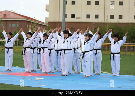 A Korean Taekwondo demonstration team begin the KATUSA Friendship Week ceremony with a martial arts performance on Camp Humphreys, Republic of Korea, 7 June, 2022. KATUSA Friendship Week is hosted annually to facilitate unit cohesion, solidify friendship and foster a cultural understanding between both countries. Stock Photo