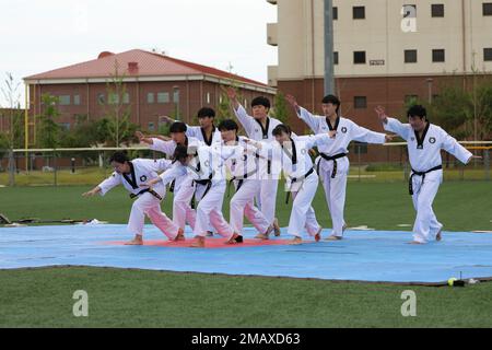 A Korean Taekwondo demonstration team begin the KATUSA Friendship Week ceremony with a martial arts performance on Camp Humphreys, Republic of Korea, 7 June, 2022. KATUSA Friendship Week is hosted annually to facilitate unit cohesion, solidify friendship and foster a cultural understanding between both countries. Stock Photo