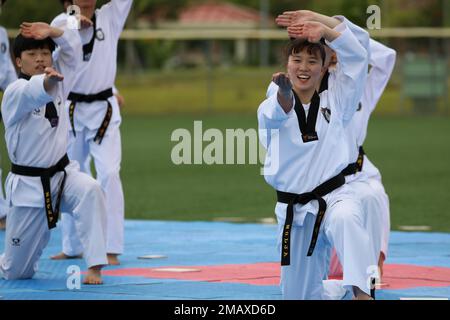 A Korean Taekwondo demonstration team begin the KATUSA Friendship Week ceremony with a martial arts performance on Camp Humphreys, Republic of Korea, 7 June, 2022. KATUSA Friendship Week is hosted annually to facilitate unit cohesion, solidify friendship and foster a cultural understanding between both countries. Stock Photo