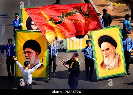 Lebanese Shiite scouts of the Iranian-backed Hezbollah group carry ...