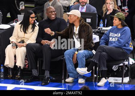 Pharrell Williams and his wife Helen Lasichanh attend the NBA