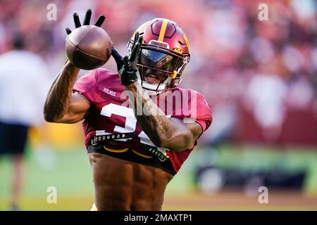 Washington Commanders cornerback Christian Holmes (34) catches a pass  during an NFL football practice at FedEx Field, Saturday, Aug. 6, 2022, in  Landover, Md. (AP Photo/Alex Brandon Stock Photo - Alamy