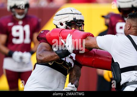 Washington Commanders defensive end Will Bradley-King (56) walks on the  field after a preseason NFL football game against the Carolina Panthers,  Saturday, Aug. 13, 2022, in Landover, Md. The Panthers won 23-21. (