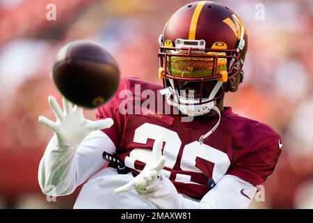 Washington Commanders cornerback Kendall Fuller (29) secures an