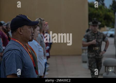 A U.S Marine Corps drill instructor with Receiving Company, Support Battalion welcomes educators from the 9th recruiting district at Marine Corps Recruit Depot San Diego, June 7, 2022. The Educators' Workshop program provides selected educators, coaches, directors and influential community members with an experiential opportunity to see how the Marine Corps transforms young men and women into Marines. Stock Photo