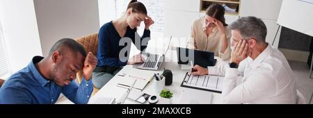 Bored Male Manger Sitting With His Colleagues Giving Presentation In Meeting At Office Stock Photo