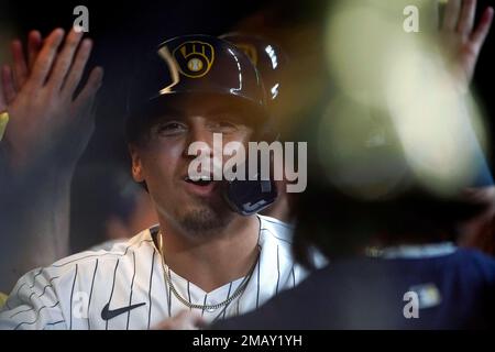 Milwaukee Brewers' Tyrone Taylor is congratulated by Hunter