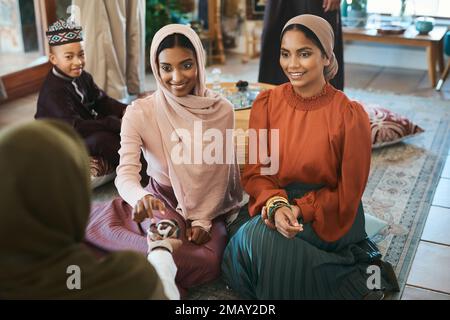 Thank you for these dates. a group of muslim women relaxing together about to break their fast with dates. Stock Photo