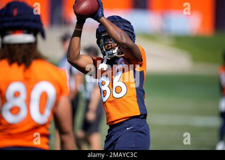 Denver Broncos running back Max Borghi (36) takes part in drills during the  NFL football team's training camp Friday, Aug. 5, 2022, at the Broncos'  headquarters in Centennial, Colo. (AP Photo/David Zalubowski