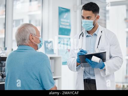 Do you have any other symptoms. a young doctor talking to a patient in an office. Stock Photo