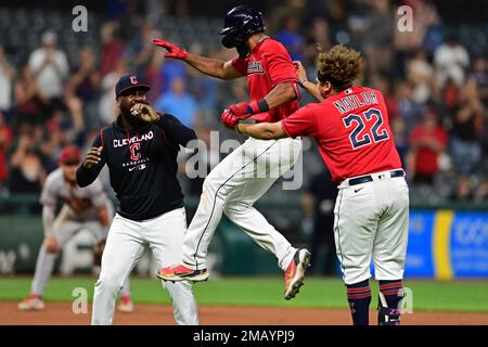 Cleveland Guardians' Amed Rosario (1) and Steven Kwan, right, celebrate  after defeating the Tampa Bay Rays in a wild card baseball playoff game,  Friday, Oct. 7, 2022, in Cleveland. (AP Photo/David Dermer