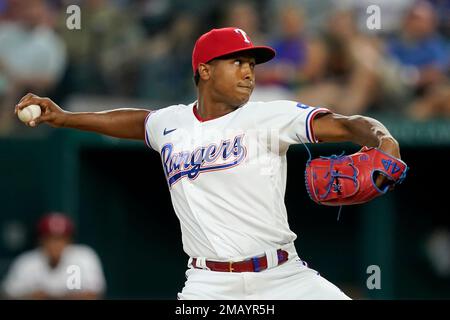 Texas Rangers relief pitcher Jose Leclerc throws to a New York