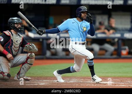 Tampa Bay Rays' Roman Quinn, right, stands on third base after hitting a  two-run triple in the seventh inning against the Kansas City Royals during  a baseball game Saturday, July 23, 2022