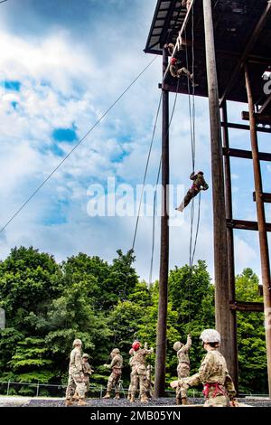 Cadets rappel from the open wall of the rappel tower on Fort Knox, Ky, June 8. Soldiers from 4th Battalion, 399th Regiment, will lead thousands of Reserve Officers' Training Corps cadets from across the country through the confidence/obstacle course and rappel tower at Fort Knox this summer starting in early June. Stock Photo