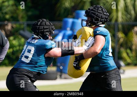 Jacksonville Jaguars offensive guard Ben Bartch, left, performs a