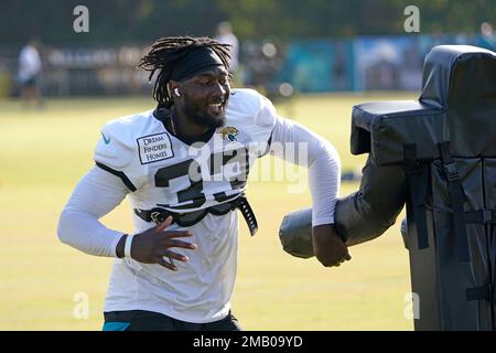 Jacksonville Jaguars linebacker Devin Lloyd (33) enters the field