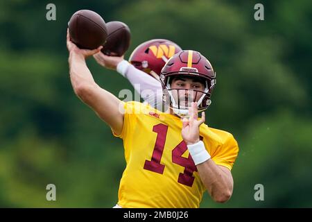 Washington Commanders quarterback Sam Howell (14) throws the ball during  the second half of a NFL preseason football game against the Baltimore  Ravens, Saturday, Aug 27, 2022, in Baltimore. (AP Photo/Terrance Williams