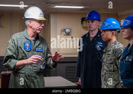 SASEBO, Japan (June 9, 2022) Vice Adm. Karl Thomas, commander, U.S. 7th Fleet, speaks with Sailors assigned to the forward-deployed amphibious assault ship USS America (LHA 6) in the ship’s flag mess. America, lead ship of the America Amphibious Ready Group, along with the 31st Marine Expeditionary Unit, is operating in the U.S. 7th Fleet area of operations to enhance interoperability with allies and partners and serve as a ready response force to defend peace and stability in the Indo-Pacific region. Stock Photo