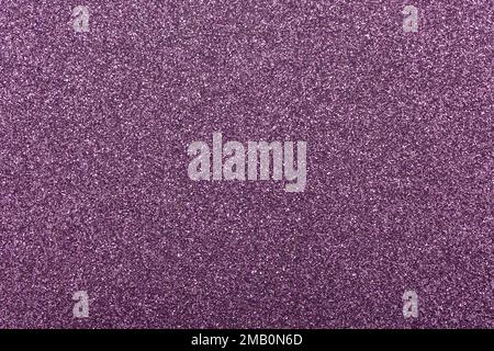 This image shows a macro abstract background of sparkling purple glitter texture surface. Stock Photo
