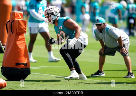 Miami Dolphins defensive tackle Zach Sieler (92) and Cleveland Browns guard  Wyatt Teller (77) exchange jerseys at the end of an NFL football game,  Sunday, Nov. 13, 2022, in Miami Gardens, Fla.