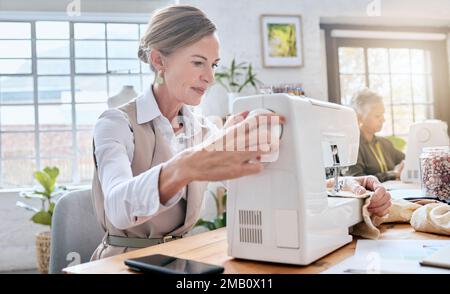 Tailor, elderly woman and sewing machine for clothes fabric, luxury apparel or creative design in studio workshop atelier. Startup small business Stock Photo