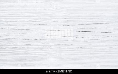 White paint on cracked wood desk background texture pattern. Stock Photo