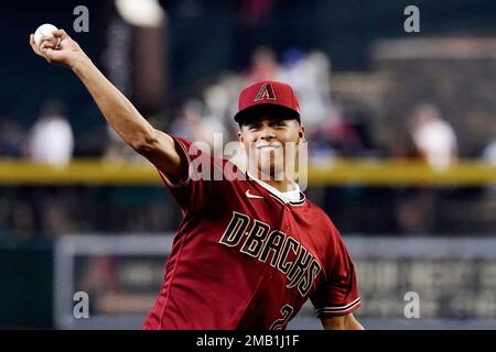 Arizona Diamondbacks' first-round draft pick Druw Jones throws out the  first pitch prior to the team's baseball game against the Washington  Nationals on Saturday, July 23, 2022, in Phoenix. (AP Photo/Ross D.