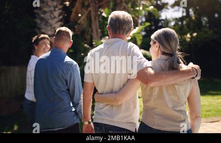 Spending some time in the sunshine with my family. a family spending a day enjoying the sunshine in their backyard. Stock Photo
