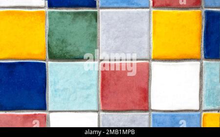Wall with rows of colorful square tiles as background Stock Photo