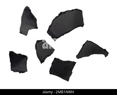 Abstract pieces of black torn paper, cardboard isolated on white, clipping path Stock Photo