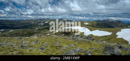 Mount Kosciuszko is Australia's tallest mountain and is pictured center of image.  Image taken from Mount Twynam which is the second tallest. Stock Photo