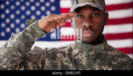 Rear View Of Military Man Saluting Us Flag Stock Photo