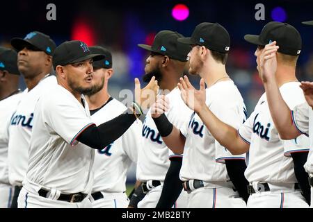 Miami Marlins left fielder Adam Duvall (14) and shortstop Miguel Rojas (19)  celebrate after Duvall's homer during a MLB game against the Los Angeles D  Stock Photo - Alamy