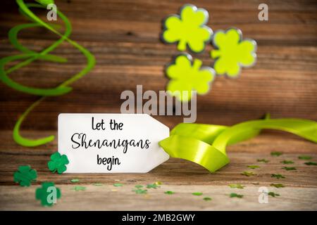 Saint Patrick's Day Decoration, Label With Text Let The Shenanigans Begin Stock Photo