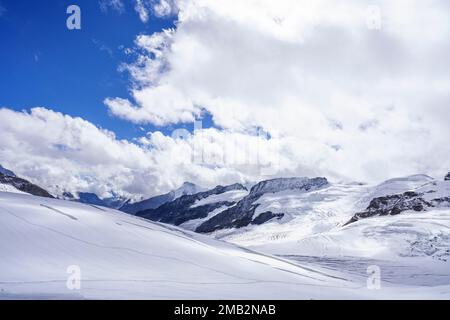 Look to Aletsch Glacier from the Jungfraujoch. Blue sky with clouds. Bernese Alps, Switzerland, Europe Stock Photo