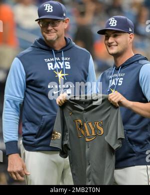 Tampa Bay Rays pitching coach Kyle Snyder, left, looks on as Shane