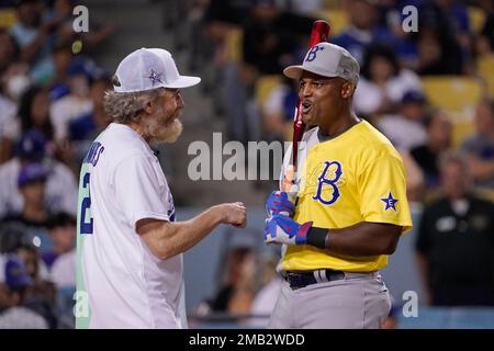 Former Texas Rangers player, Adrian Beltre (left) waves to the