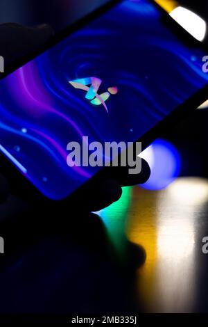Woman's hand holding an iPhone with artificial intelligence art app. AI art in artificial intelligence time. 01.01.2023 Amsterdam, Netherlands Stock Photo