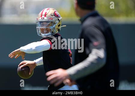 FILE - San Francisco 49ers quarterback Steve Young upends Dallas