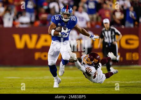 New York Giants' Saquon Barkley runs on the field before an NFL football  game against the Washington Commanders, Sunday, Dec. 4, 2022, in East  Rutherford, N.J. (AP Photo/John Minchillo Stock Photo - Alamy